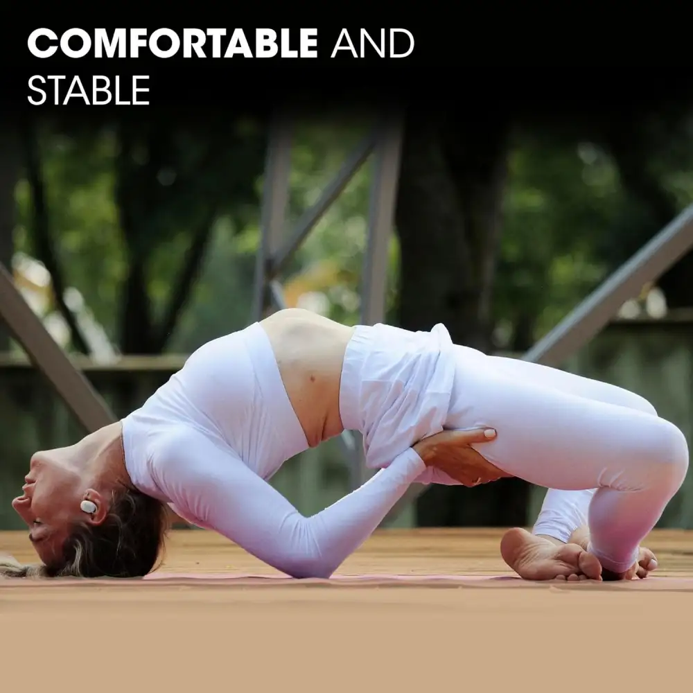 Product shot of JBL Endurance Race 2 earbuds placed beside the charging case on a modern surface.