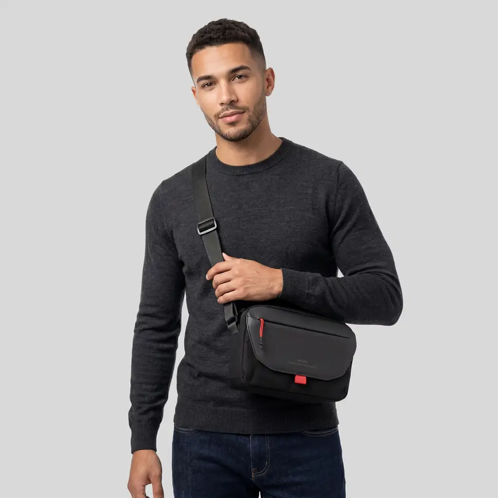 Model wearing the WiWU WARRIORS Crossbody Bag featuring premium CORDURA® fabric, adjustable shoulder strap, and smart everyday carry design